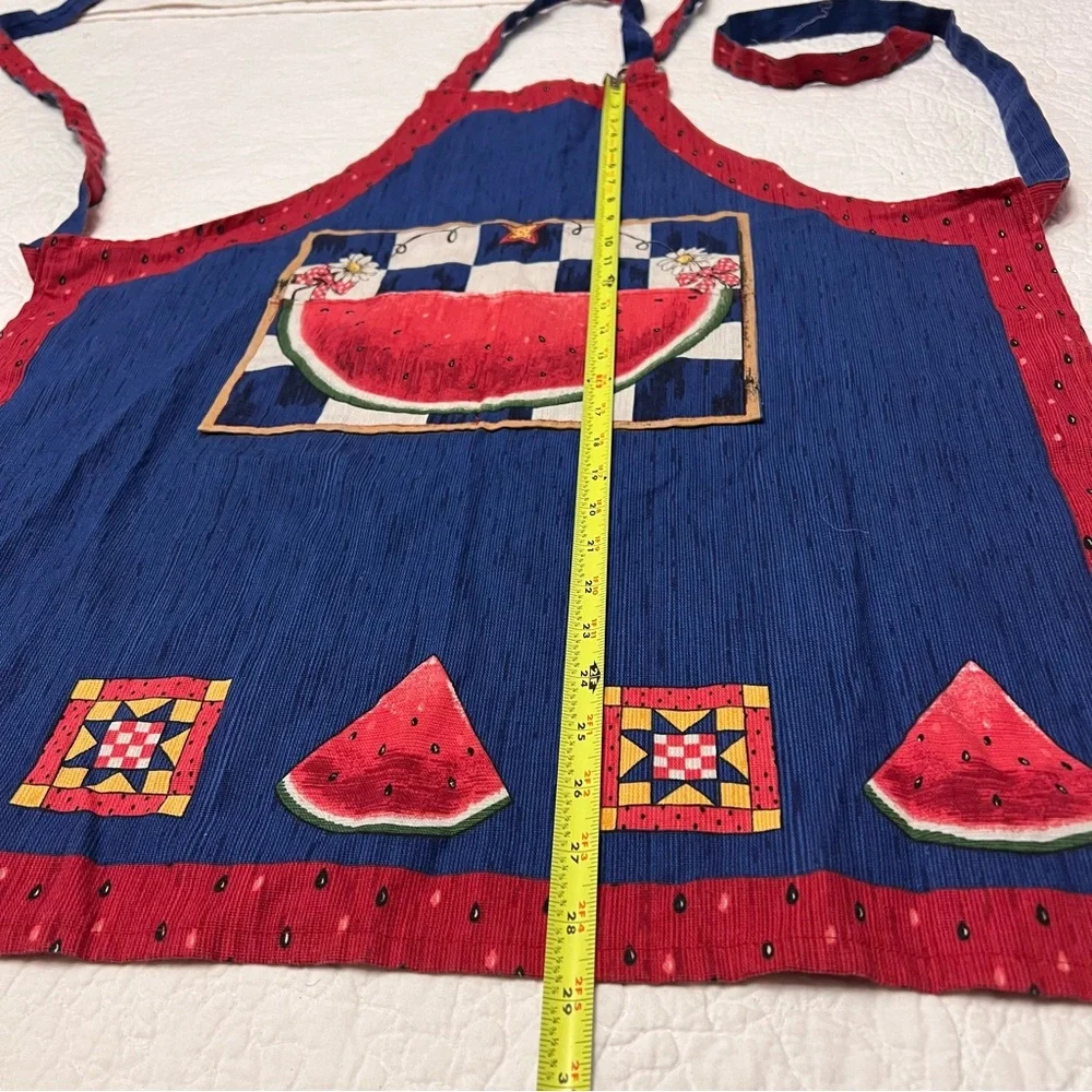 This is a vintage folk cottage style watermelon apron in red, white, and blue